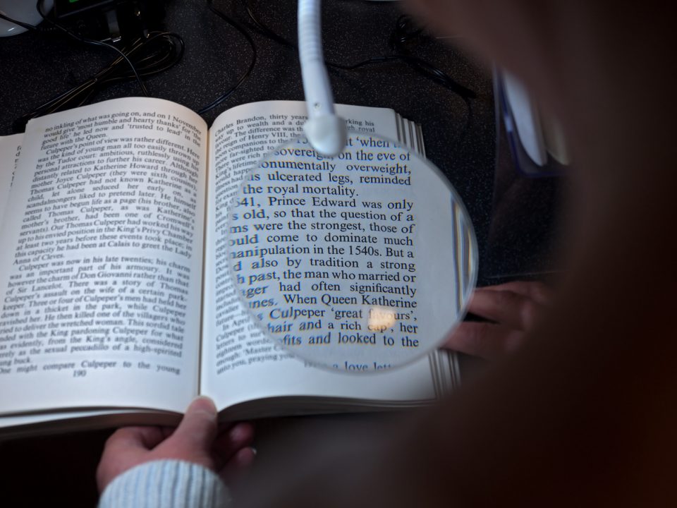 a magnifying lens used to read a book