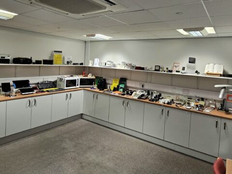 MySight York's Equipment Centre - there are cabinets with displays of the different equipment all along the top. There is also shelves with equipment on display.